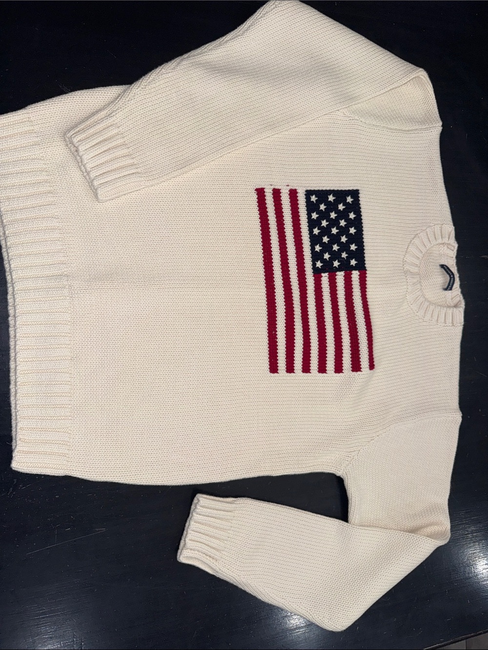 brandy melville cream colored flag sweater. one size. like new.